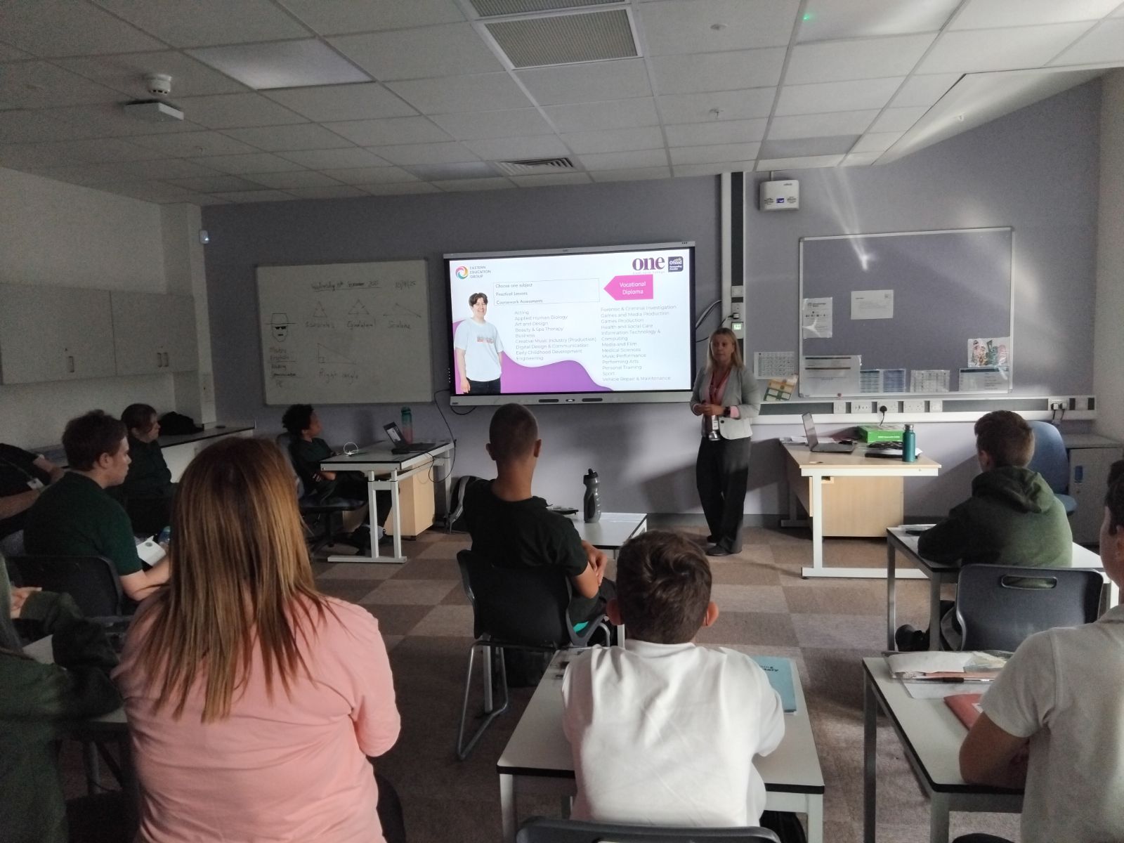 Children at their desks watching a presentation