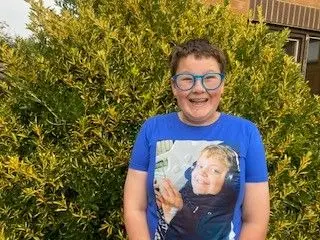 A shot of Ozzy wearing a tshirt which has the face of his friend Jake on it
